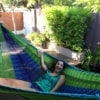Beautiful girl drinking in a king size hammock in Perth Australia
