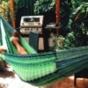 Man sleeping in comfy hammock in backyard