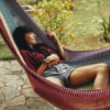 Beautiful woman laying in best hammock in Queensland